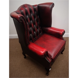  Georgian style wingback armchair upholstered in ox blood red leather, cabriole legsW91cm  