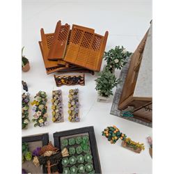 1:12 scale dolls house allotment and garden accessories, including wooden shed on a stone effect base, two vegetable patches, terracotta plant pots with flowers and foliage, stone effect plant pots, other planters, loose sunflowers, scarecrow, rabbit hutch, garden tools, fencing panels, etc 