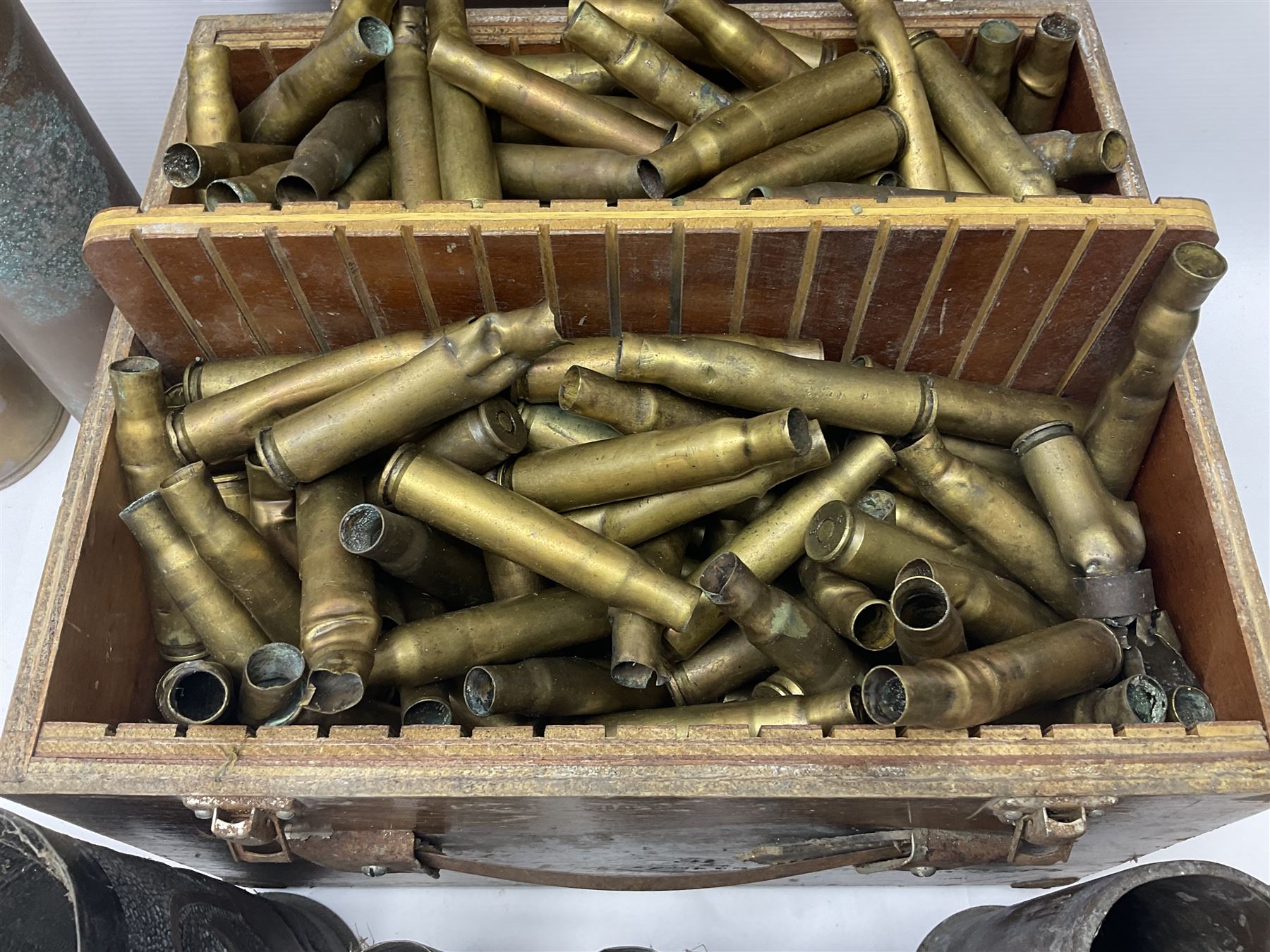 Large collection of shell and bullet casings, including a trench art example, together with a metal cartage case and wooden case