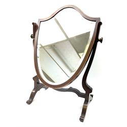 A Victorian mahogany swing toilet mirror, of shield form, H58cm L38cm.