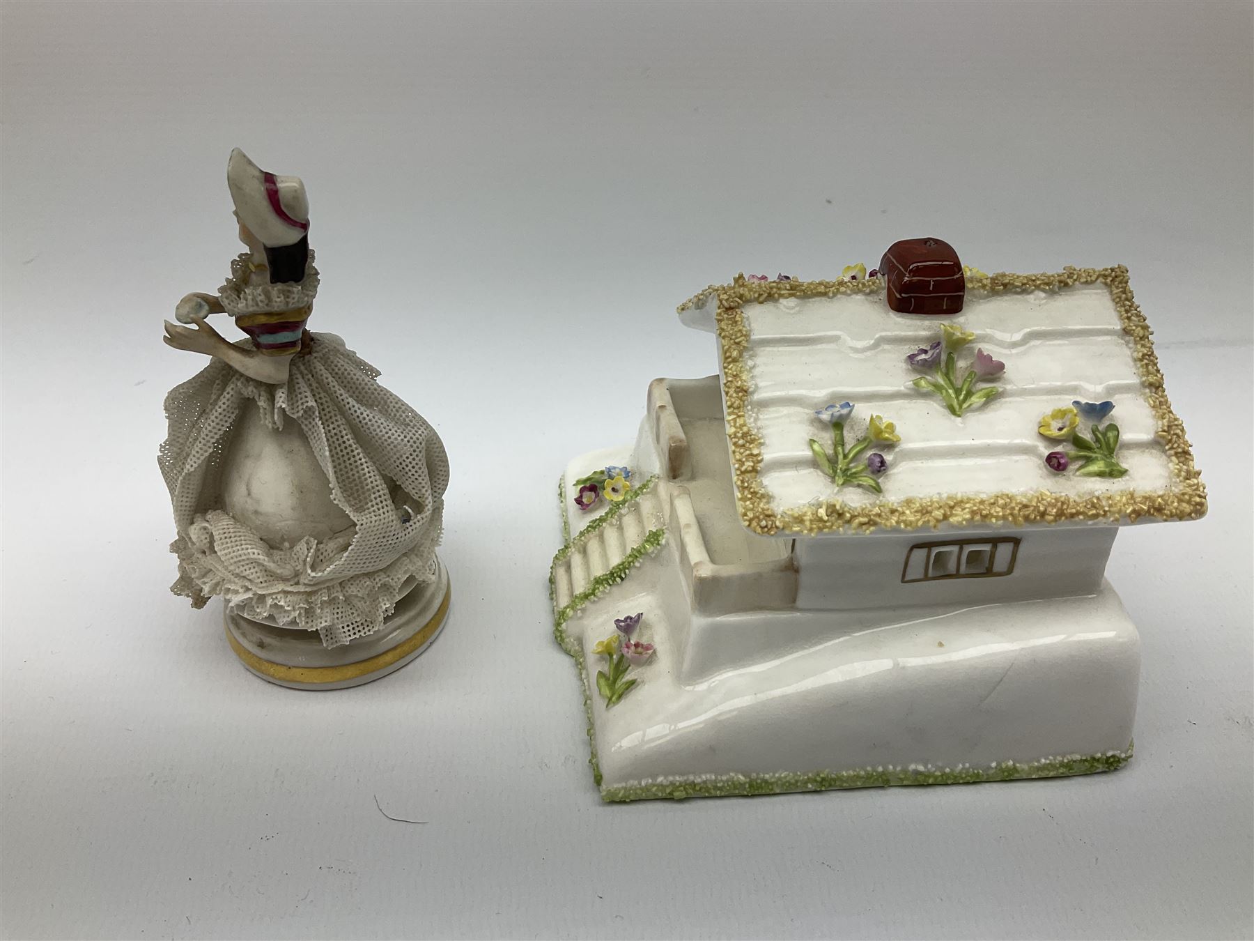 Group of figures, comprising six Royal Doulton examples, Daydreams HN1731, Silks and Ribbons HN2017, Tom Sawyer HN2926, Marie HN1370, Bo-Peep HN1811, and Tinkle Bell HN1677, together with a Dresden type 'lace' example, and a Coalport 'Swiss Cottage', (8)