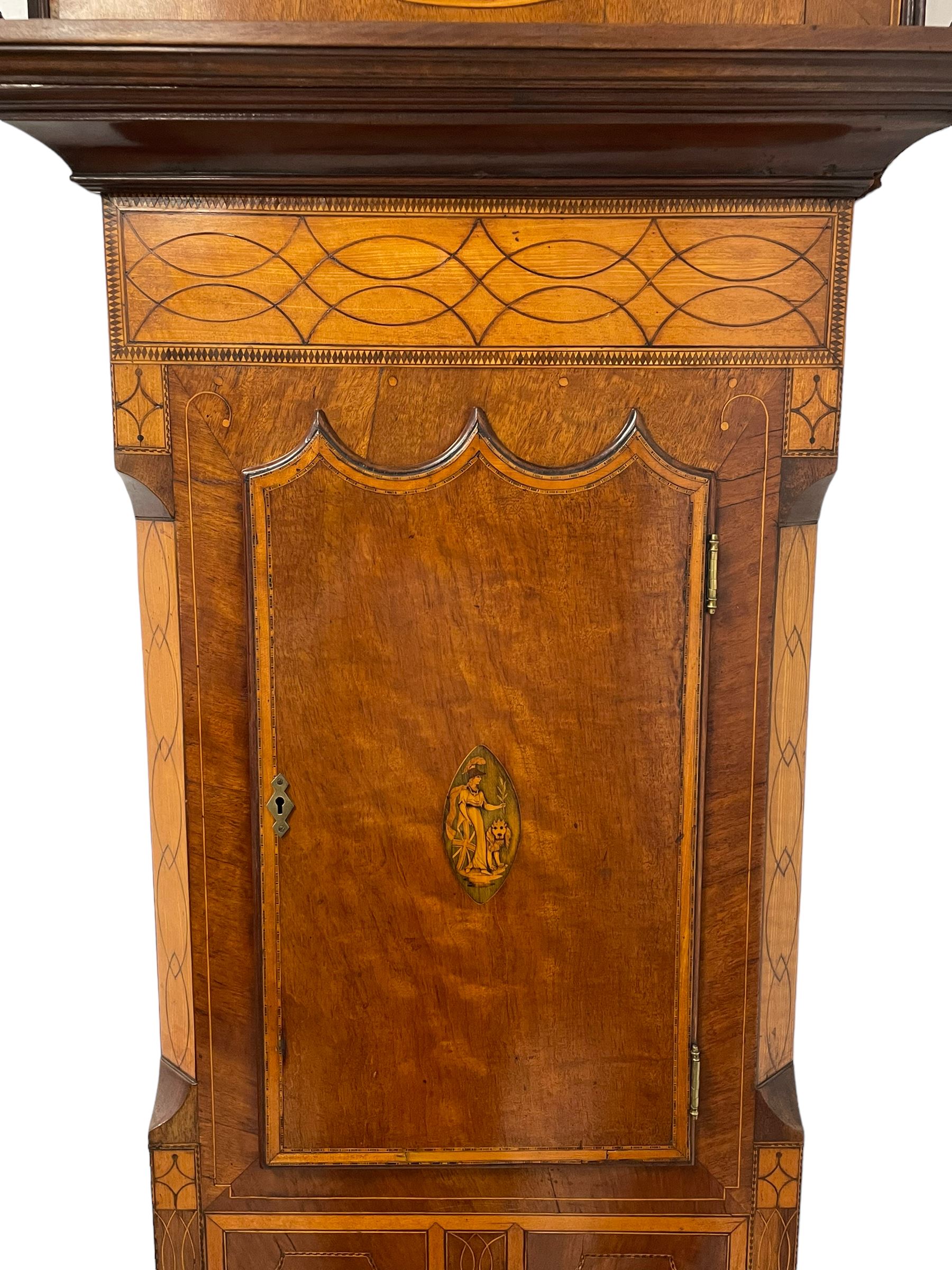 John Stonehouse of Leeds - mahogany 8-day longcase clock with a painted oval dial c1830, hood with a swans necked pediment and profuse contrasting inlay to both the hood and case, oval hood door with flanking pilasters and Corinthian capitals, conforming case with canted corners and short triple spire door, broad plinth with matching inlay and canted corners on shallow base, dial depicting masonic regalia, symbols, and pictorial depictions of the humanities, faith, hope, charity and righteousness, black chapter with white roman Arabic’s, date recorder and matching “crown” hands, dial pinned to a rack striking movement with a recoil anchor escapement, striking the hours on a coiled underslung gong. With weights and gridiron pendulum. 
This clock case is of large, impressive dimensions and was almost certainly commissioned for a large masonic lodge in Leeds, a rare and unique example.