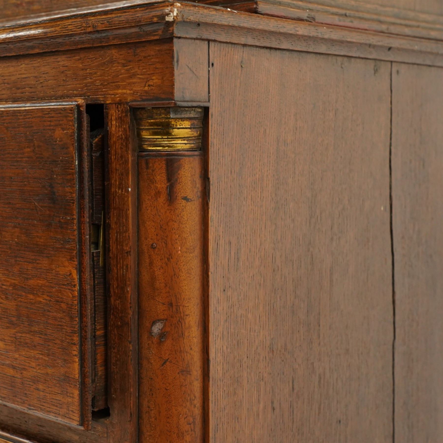 George III oak and mahogany bound enclosed bookcase-secretaire, panelled cupboards over four drawers
