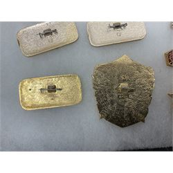 Nineteen Russian Soviet Tank Commemoration badges and medals, in small display case
