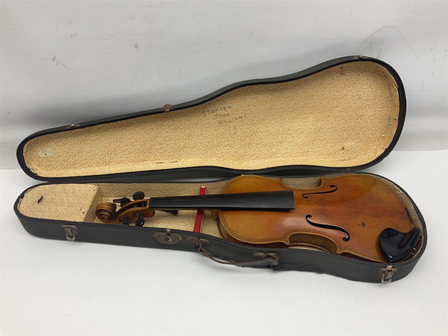 German trade violin c1900 copy of a Maggini with 36.5cm two-piece maple back and ribs and spruce top; double scroll; L60cm overall; in carrying case