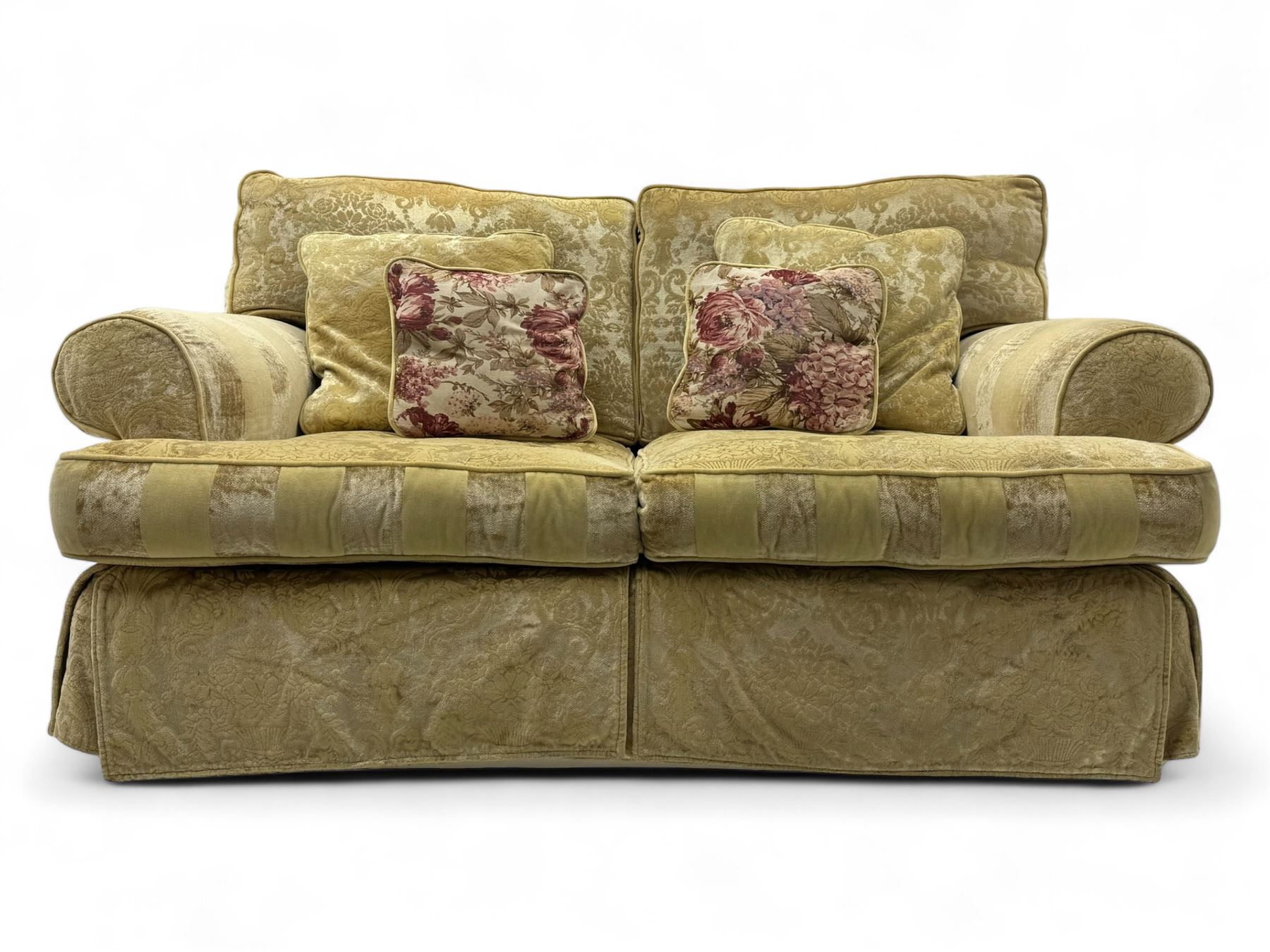 Contemporary two-seat sofa, upholstered in damask fabric with a pale gold floral pattern, rolled arms with covers, loose back and seat cushions, on matching skirted base with concealed castors