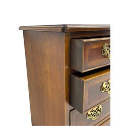 Georgian design mahogany and walnut straight-front chest, rectangular top with feather and crossband, fitted with four graduating drawers, each with cock-beaded and banded facias, fitted with pierced brass plates and drop handles, raised on bracket feet