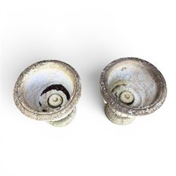 Pair of classic design cast stone garden urns, circular bowl detailed with lion mask loop handles