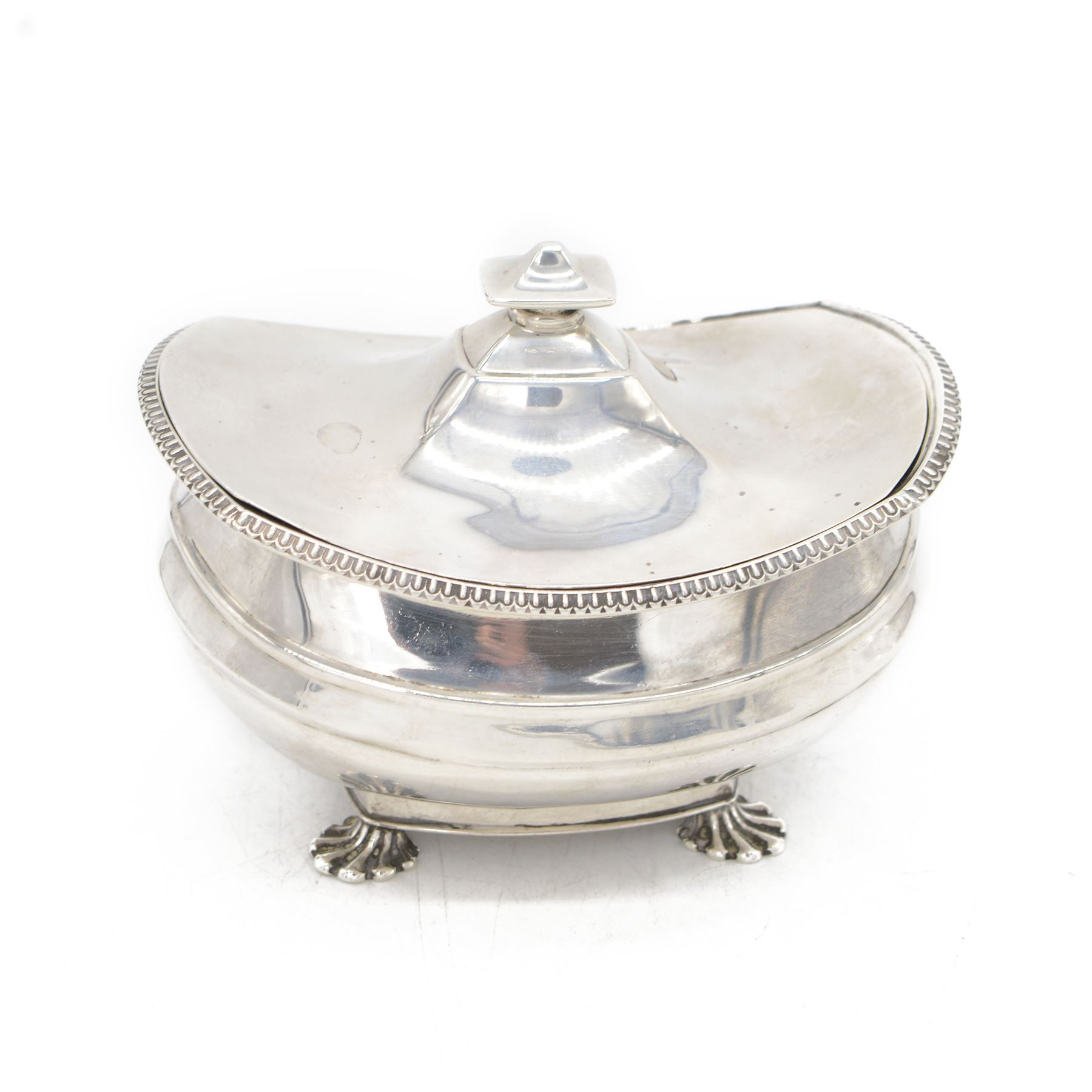 1920s silver sucrier and cover, of oval form with oblique gadrooned rim, the cover with rectangular finial, upon four splayed feet, H10.5cm
