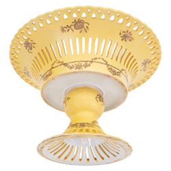 Continental tazza, decorated with swag, the central panel with cerub, marked Toussi Court beneath, H20cm