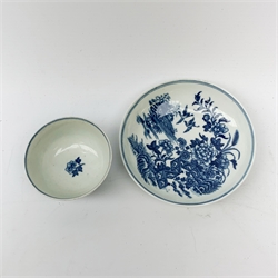 An 18th century Worcester porcelain half size tea bowl and saucer, each transfer print decorated in underglaze blue with the Fence pattern, each with crescent mark beneath, tea bowl D7.5cm, saucer D12cm diameter. (2). 