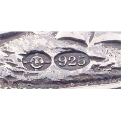 Late 19th century German Hanau silver box, of shaped rectangular form, embossed throughout, the hinged cover decorated with a central oval panel depicting a genre scene with musicians, the corners detailed with masks, the sides detailed with conforming figures and musical trophies, opening to reveal a gilt interior, with Hanau marks for Neresheimer & Sohne, and hallmarked B Muller & Son, London import 1907, approximate weight 3.32 ozt (103.4 grams)