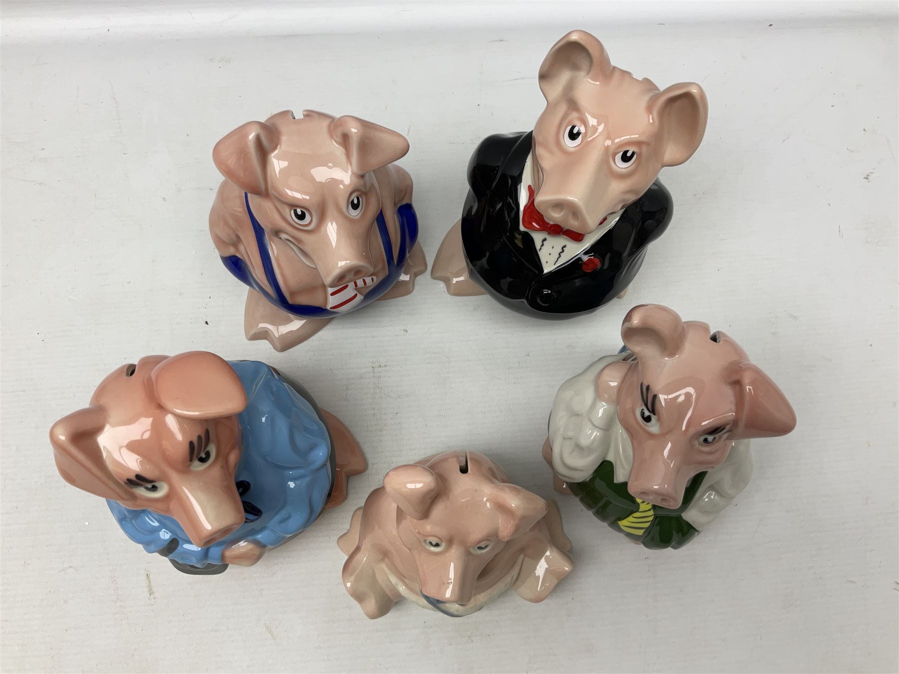 Set of five Wade NatWest money boxes, comprising father, mother, boy, girl and baby, four with original boxes 