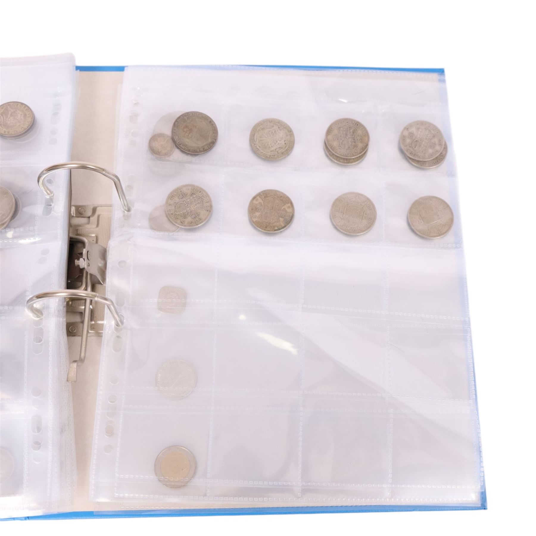 Great British pre-1947 silver coins, including two shillings, four florins, and two half crowns, and further pre decimal coins, in blue ring binder folder