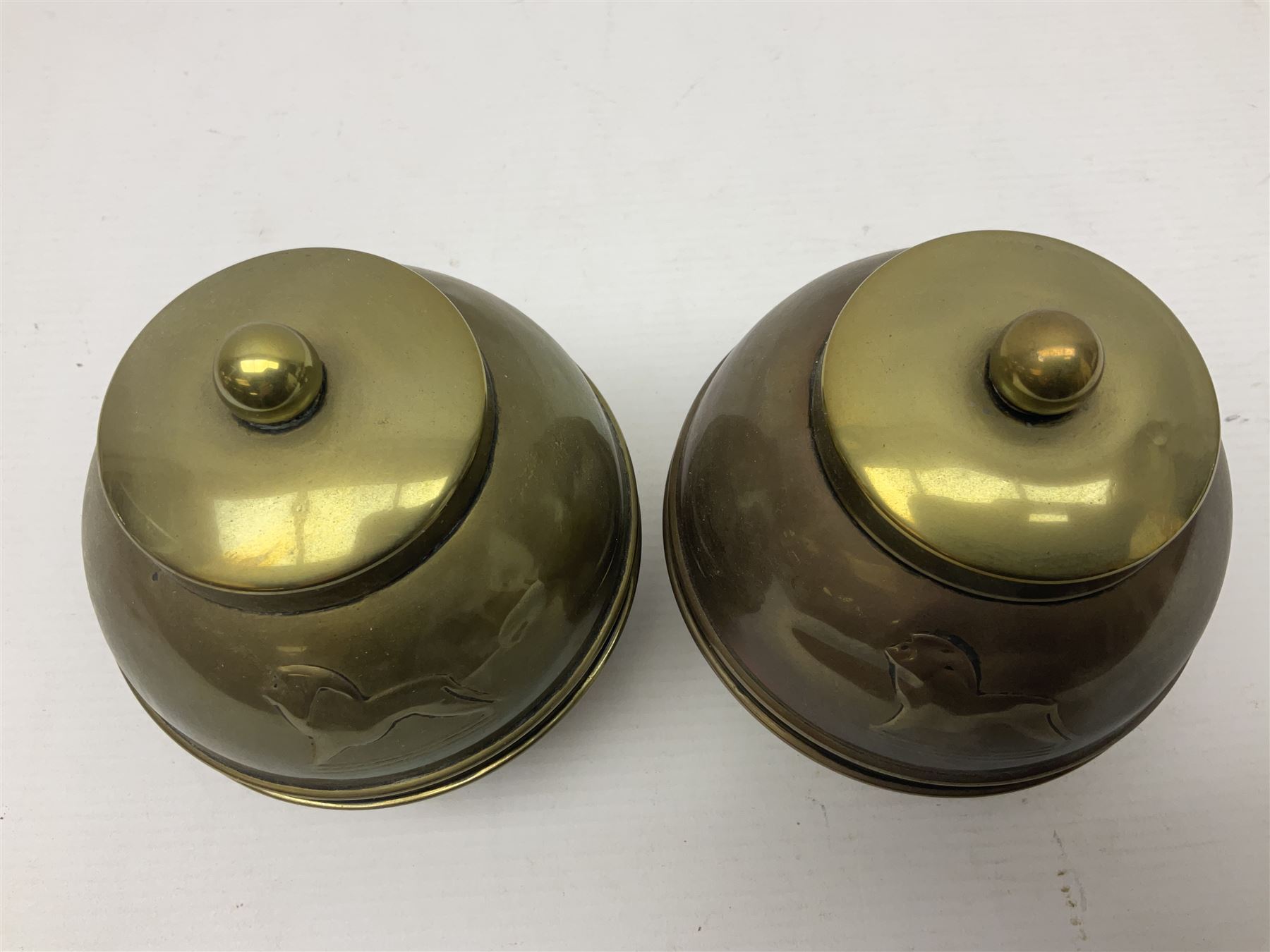 Pair of brass 1924 commemorative tea caddies, of ovoid form the waist embossed with 'British Empire Exhibition 1924' 'Lipton's Souvenir Tea Caddy', H18cm