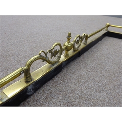  Telescopic brass fire fender with central scroll decoration, L147cm  