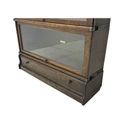 Globe Wernicke - stacking sectional library bookcase, over four glazed up-and-over doors, each bearing original makers mark, on moulded plinth base with inbuilt drawer