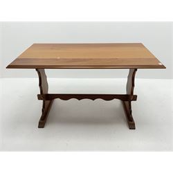 Late 20th century teak table, moulded rectangular top on shaped end supports joined by pegged stretcher, sledge supports