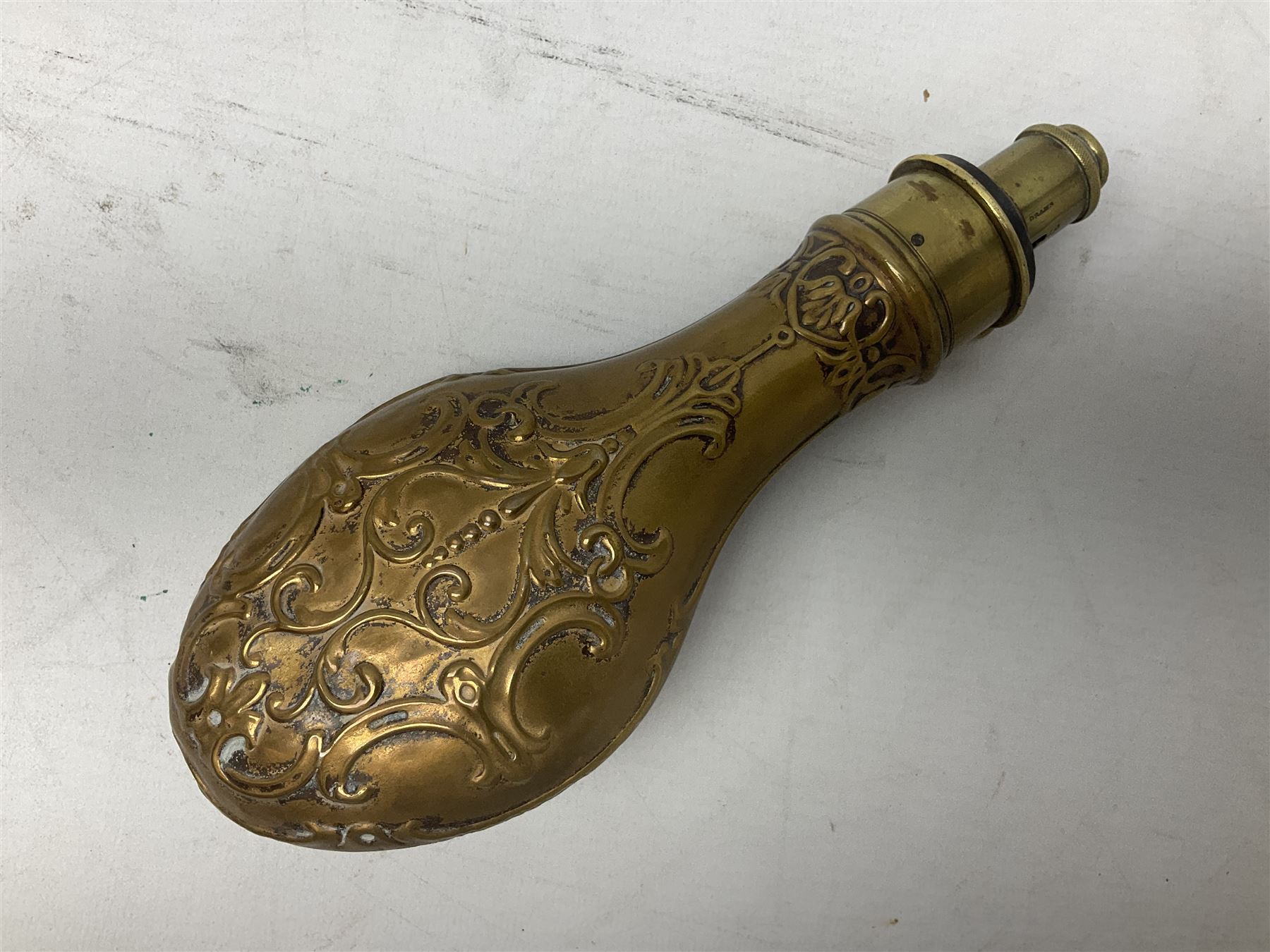 Copper and brass powder flask by G. & J.W. Hawksley Sheffield with embossed panel of 'Pharaohs Horses' to one side H21cm