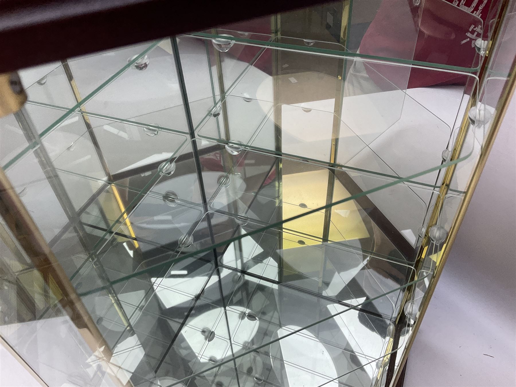 Swarovski Crystal Masquerade trilogy; 1999 Masquerade Pierrot, 2000 Columbine, 2001 Harlequin all with accompanying plaque, stand and original box, together with a glass display case with mirrored back and sides 