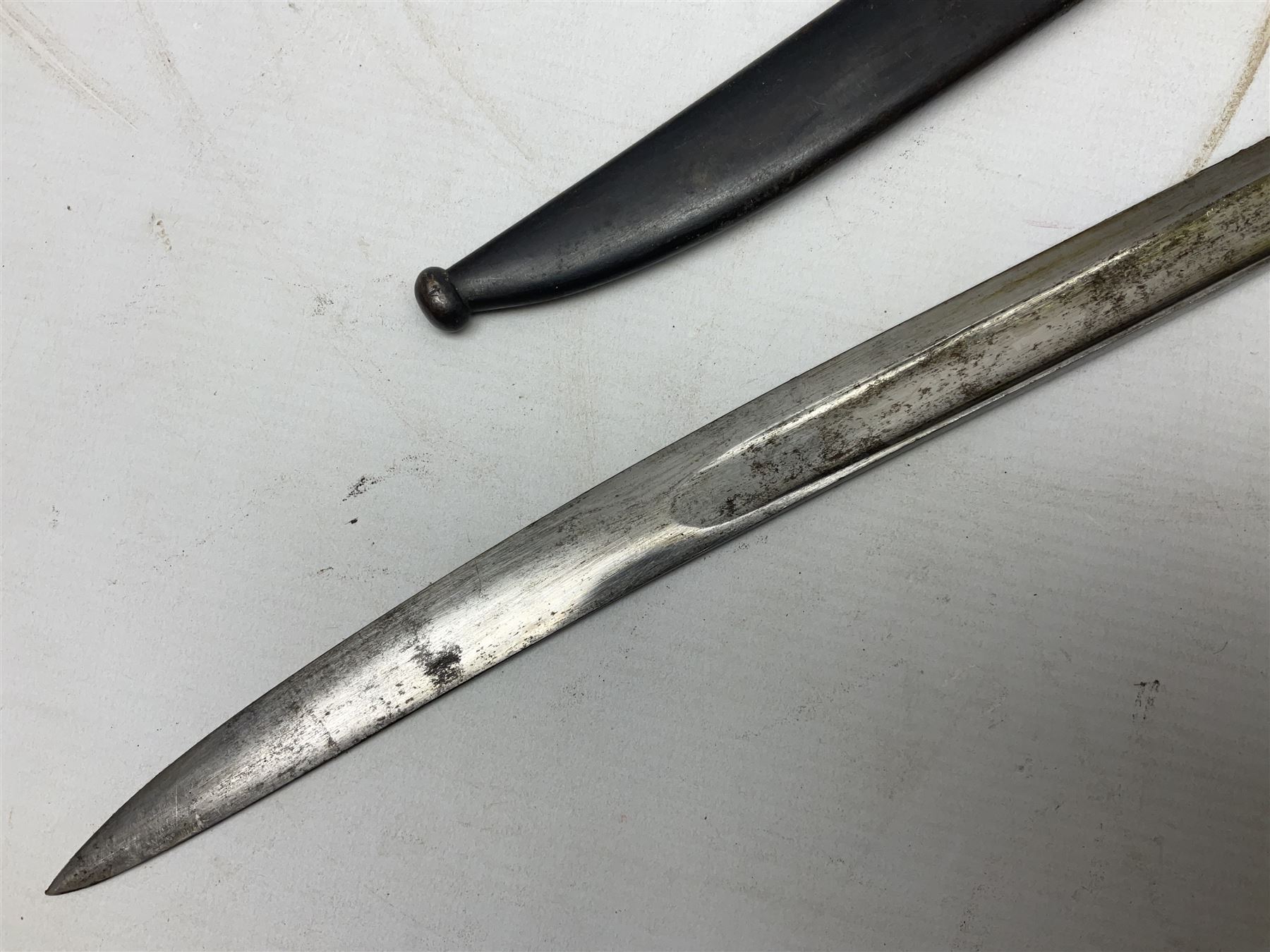 French Model 1866 Chassepot bayonet with 57cm curving fullered steel blade dated 1873 No.L63963; in steel scabbard with conforming number L71.5cm overall; and French St. Etienne Gras bayonet dated 1878 No.K10674 in steel scabbard numbered 79437 (2)