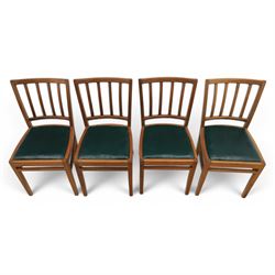 Mid 20th century teak extending dining table, together with eight teak chairs with green leather seats, extends to 154cm