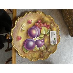 Late 20th century Royal Worcester star plate, of circular form with shaped with gilt shaped rim, hand painted by E Clark with still life of fruit upon mossy ground, signed E Clarke, with marks beneath including limited edition no 28/100, with makers fitted card box, D23cm
