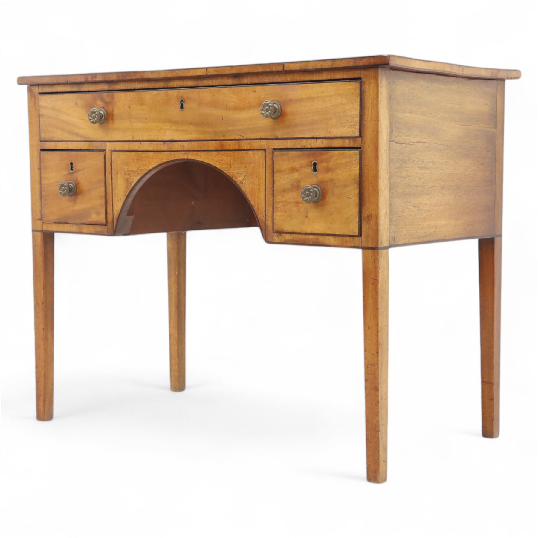 Early 19th-century mahogany kneehole desk with ebony stringing, rectangular top above an arrangement of one long and four short drawers, each with brass knob handles, raised on square tapered legs