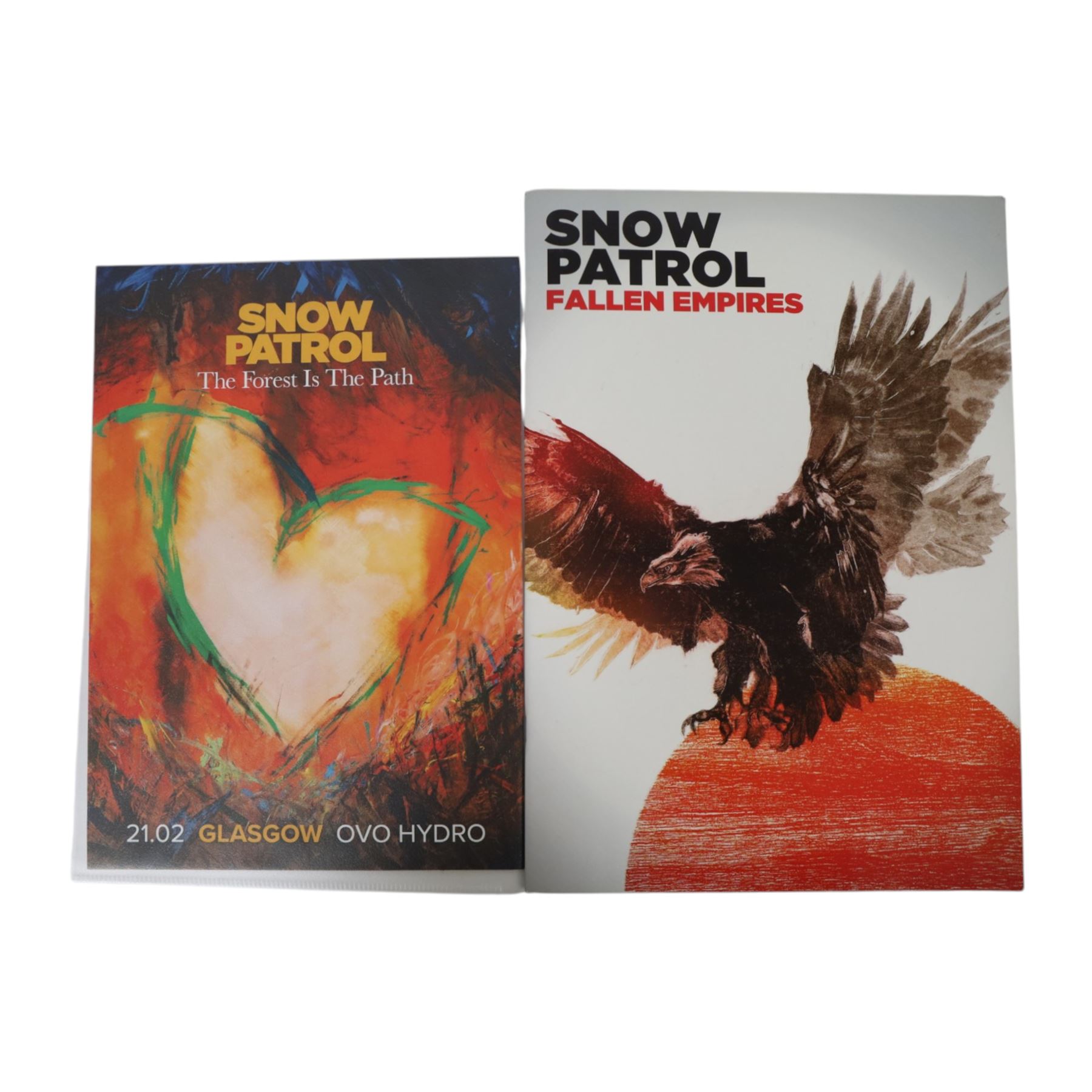 Snow Patrol memorabilia, including 'The Forest is the Path' book, art card and CD cover the book signed by  Gary Lightbody and the others signed by Gary Lightbody, Johnny McDaid and Nathan Connolly, together with Fallen Empires tour programme, tour advert, two tote bags, enamel pins, cassette and framed Chasing Cars gold coloured CD with printed signatures