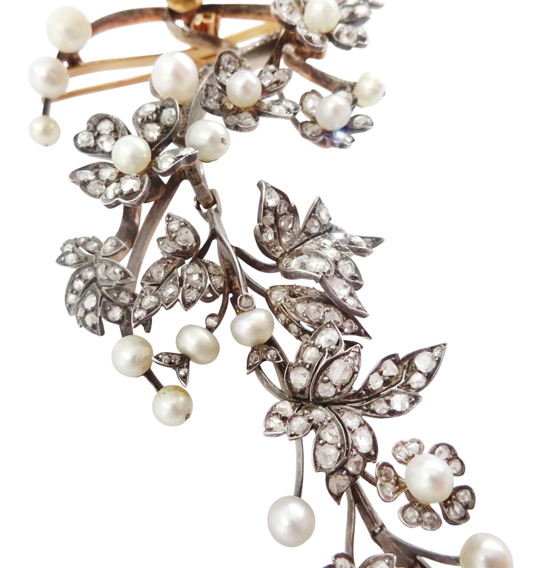 19th century gold and silver diamond and pearl en tremblant detachable brooch, the flower tremblant with a principal old cut diamond of approx 1.90 carat, the petals and stamen set with old cut and rose cut diamonds, total diamond weight approx 9.10 carat, to a foliate spray set set with further rose cut diamond and white / pink / cream pearls and ribbon tie