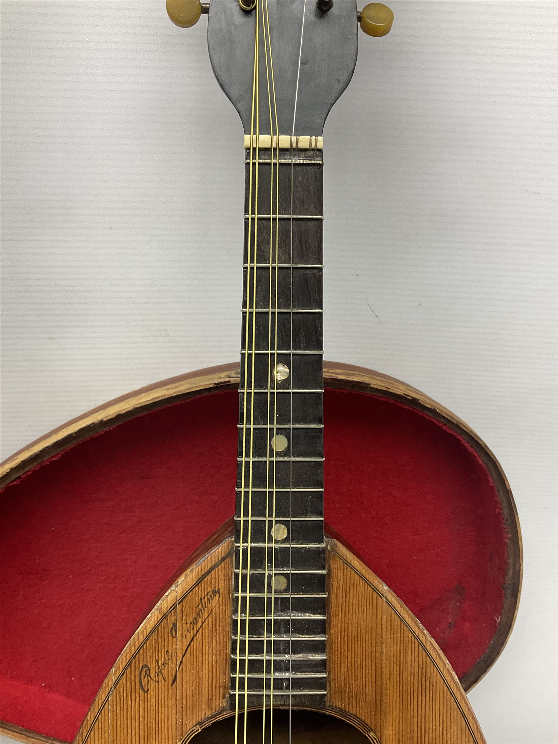 Early 20th century Italian Rafaele Disantino eight-string mandolin with two-piece back and spruce top with stamped Rafaele Disantino signature; bears maker's label L61cm; in wooden carrying case