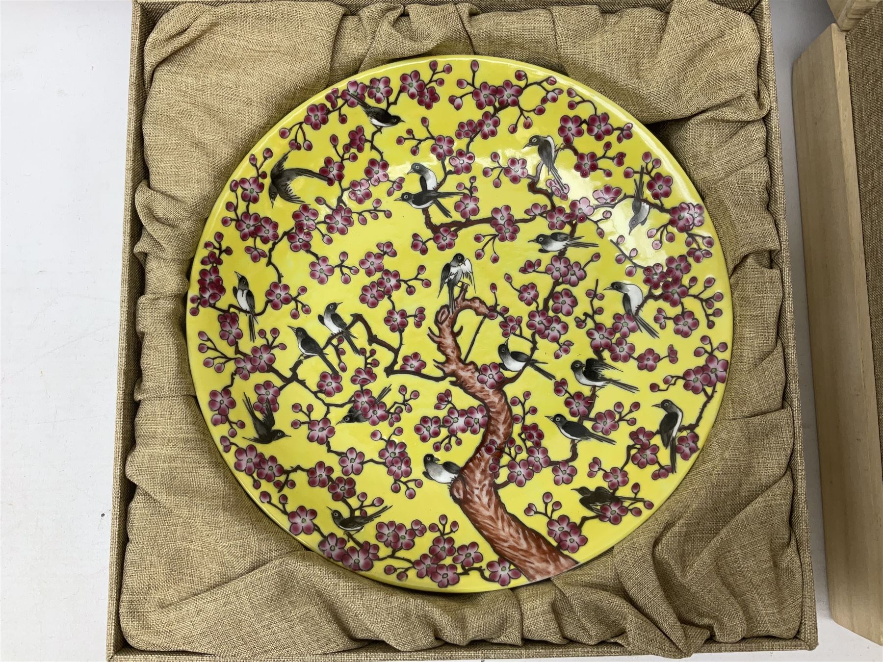 Three Chinese polychrome enamel plates each decorated with floral decoration, all marked beneath, D21cm 