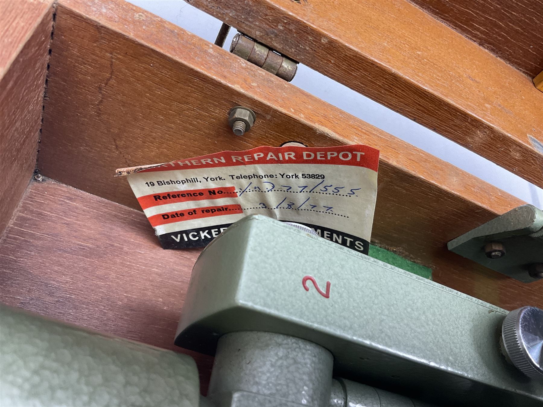 Vickers Instruments England Cooke V22 surveyor's theodolite, No.V.221387, with green enamelled body H32cm; in fitted wooden carrying box with retaining bar and repair label dated 3/8/77.