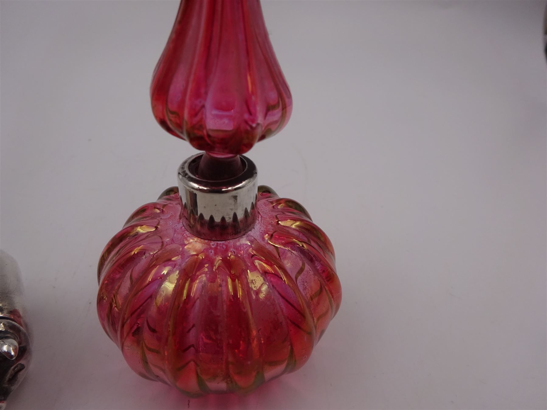 Modern novelty silver tape measure, in the form of a pig, hallmarked CME Jewellery Ltd, together with a silver mounted pink glass scent bottle, signed H. White to base, with silver collar hallmarked Laurence R Watson & Co, Birmingham 1996, scent bottle H12cm