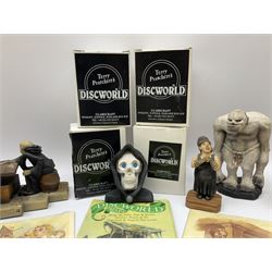 Terry Pratchett Discworld figures, designed by Clarecraft, comprising Death and Granny Weatherwax, DW90, Deathhead DWE8, Dried-frog pill box, boxed, DW63, Death as Beau Nidle, boxed, DW88, Agnes Nitt DW68, Detritus, DW22, Bonsai mountain, DW78, Volcanic bonsai mountain, boxed, DW79, Bonsai mountain valley, DW80, together with the Discworld mapp, and a collection of Terry Pratchett cards.  