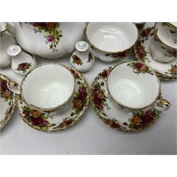 Royal Albert Old Country Roses pattern tea service for six, comprising teapot, sucrier, milk jug, dessert plates, one cake plate, one two tiered cake stand, salt and pepper pots and bud vase 