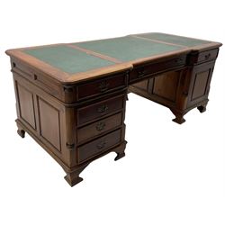 Georgian style hardwood partner's desk, the shaped top with three sectional leather insets, fitted with drawers and cupboards, on bracket feet