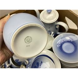  Bing & Grondahl, Copenhagen blue and white Christmas Rose pattern tea wares, to include teapot, covered sucrier, milk jug, fourteen cups and seventeen saucers, etc, together with two Royal Copenhagen collectors plates etc  