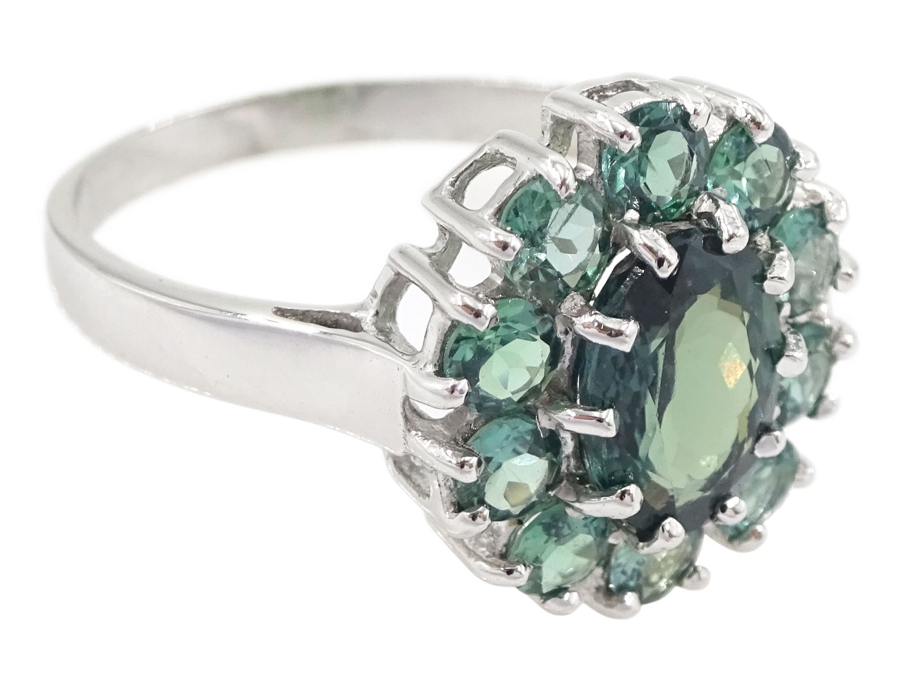 18ct white gold green sapphire cluster ring, oval cut sapphire of approx 1.40 carat, surrounded by ten round cut sapphires, Birmingham 2005, total sapphire weight approx 2.40 carat