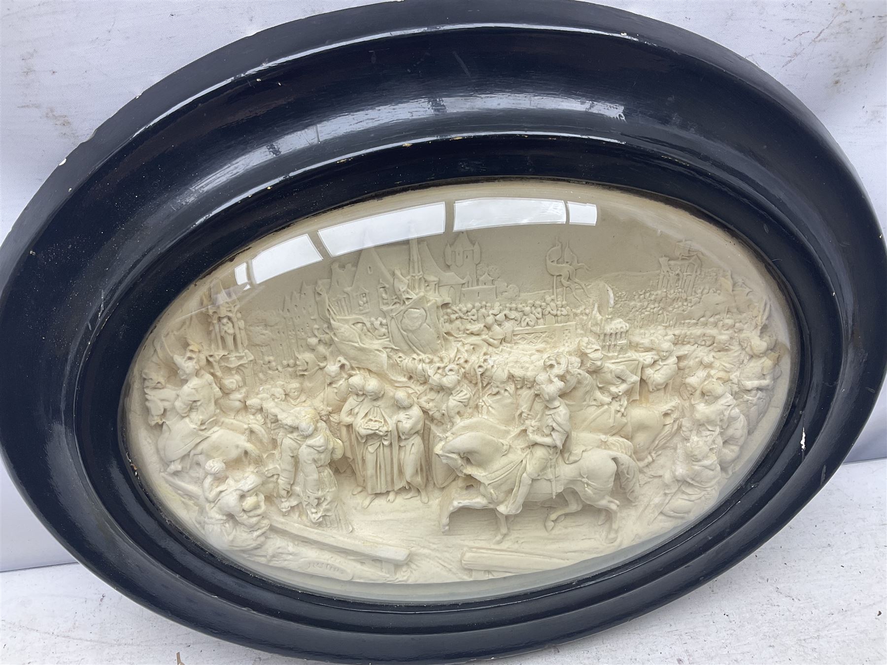 Justin Mathieu; oval high relief plaque depicting a battle scene, within frame H36cm