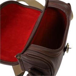 Leather cartridge bag with a canvas strap, together with another cartridge bag, two leather belts etc