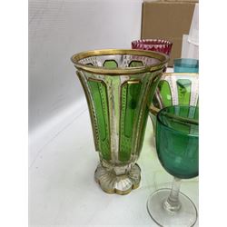 19th century and later glassware, to include ruby glass overlay cup etched with Forget me not and flowers, cut bohemian style bowl with panels of green bordered with gilt foliate patterns, together with a matching vase with petal foot, cranberry glass, two engraved glasses decorated with stars, green glasses etc
flash bohemian style vase