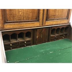 Early 19th century oak and mahogany banded bureau bookcase, projecting cornice over figure frieze and two panelled doors with fan inlays, shell inlaid fall front enclosing fitted interior, two short and three long drawers, W122cm, H204cm, D53cm