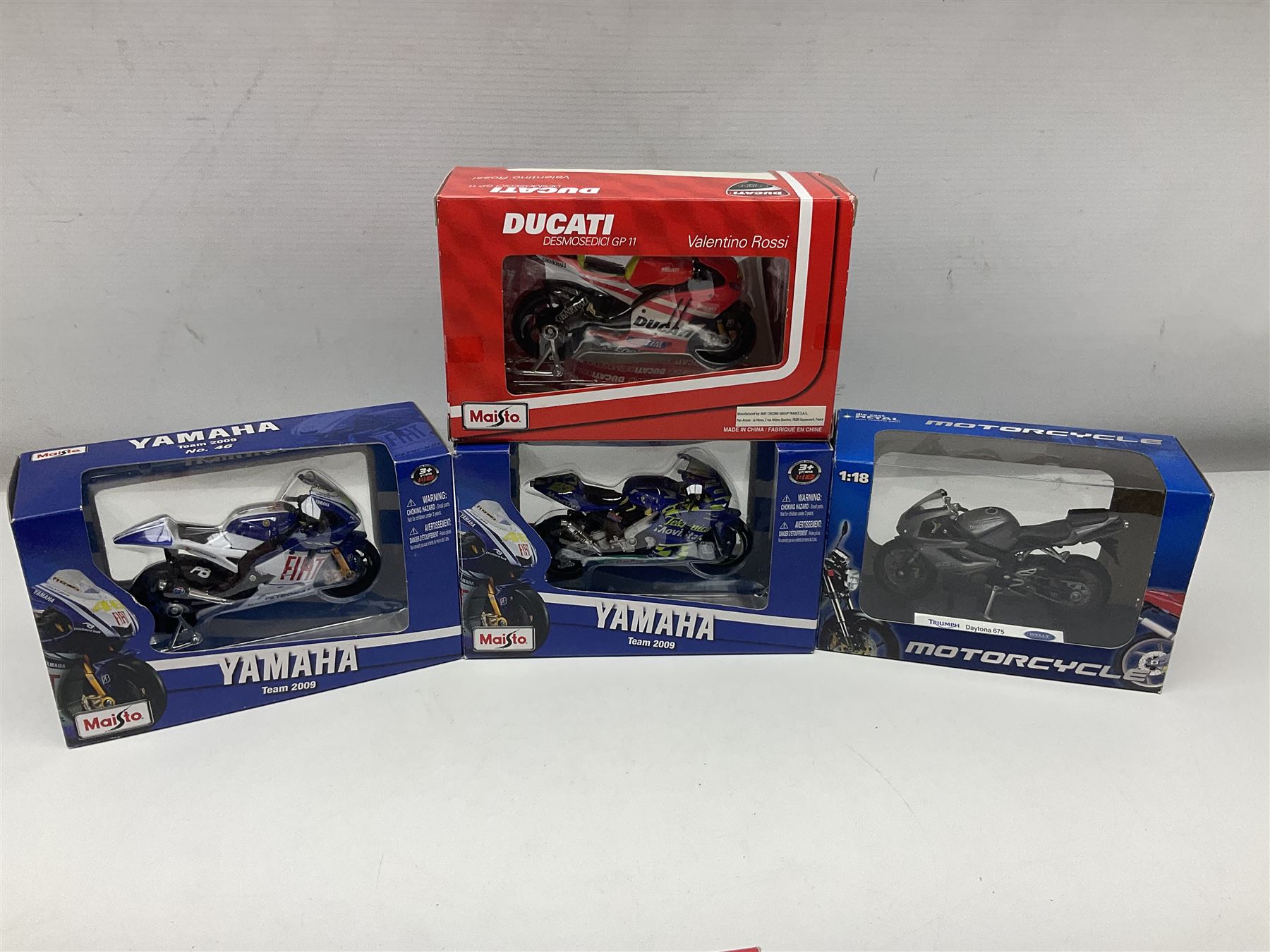 Fifty-one die-cast models of motorcycles by Maisto, Protar Italeri, Welly etc; many in perspex display boxes, some in window boxes and some unboxed