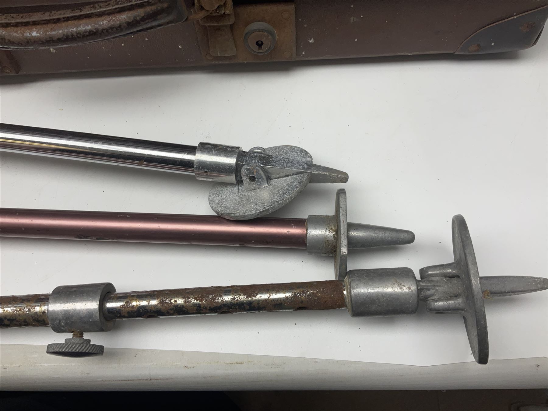 Three shooting sticks, together with four vintage leather brown suitcases of various sizes, largest suitcase H40cm L65cm 