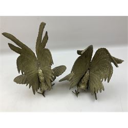Pair of 20th Century cast brass figures of fighting cockerels, together with a smaller base metal pair, largest approx 20cm