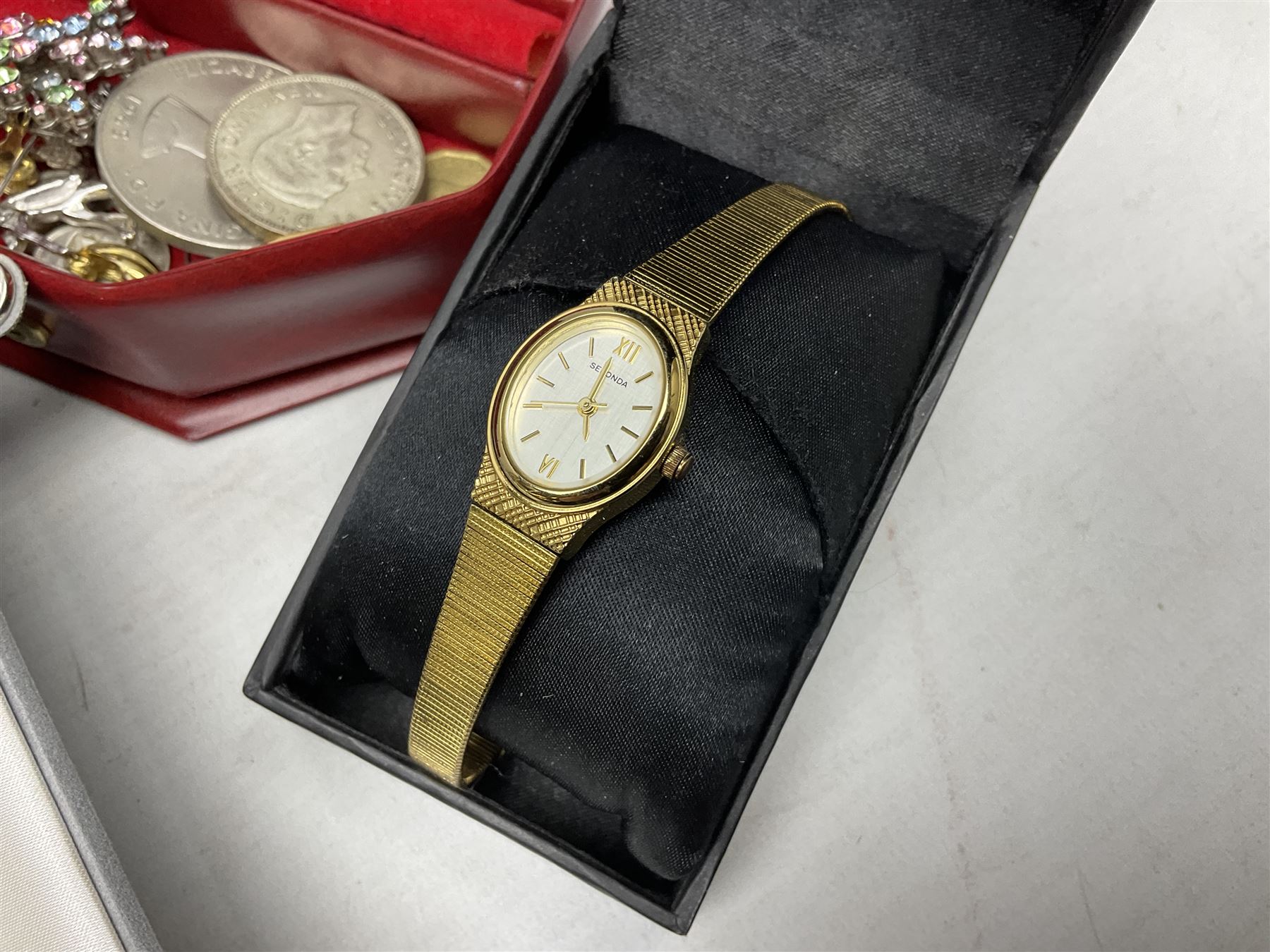 Victorian and later silver jewellery including engraved oval locket pendant, bangle, fob watch, vesta case, faux pearl necklace, butterfly wing pendant etc, a collection of costume jewellery including beaded necklaces, brooches, earrings, ladies wristwatches and a small collection of coins including two pre 1947 half crowns 