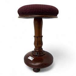 William IV mahogany revolving piano stool, circular padded seat upholstered in burgundy pa...