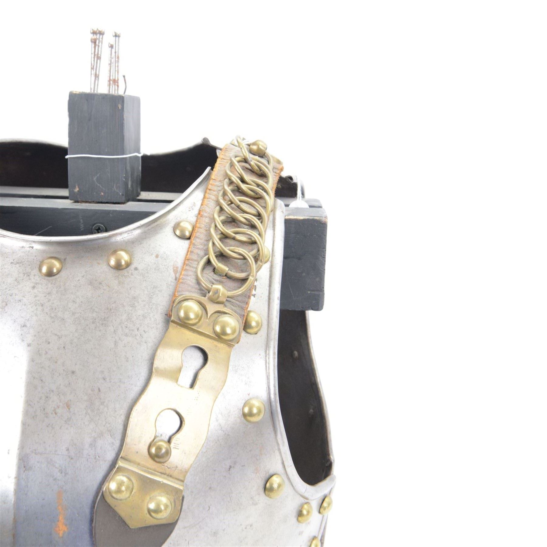 Napoleonic Belgium Cuirassier breast and back plate, circa 1814, with raised medial ridge and shallow apron, rolled edge and brass studded decoration, the shoulder chains secured by chest studs, H40cm