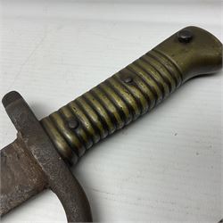 WWI Remington Pattern 1913 bayonet, the 43cm fullered blade with various marks to the ricasso including date code 11 16; in leather covered scabbard with various stamps including JWB 17 L58cm overall; and a French Model 1866 sabre bayonet (no scabbard)